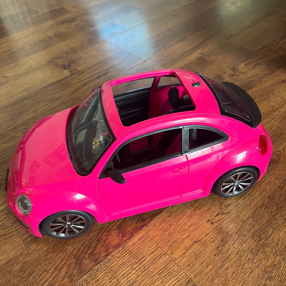 Barbie pink VW beetle car